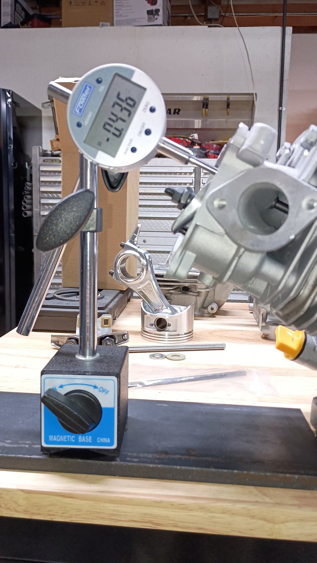 Digital indicator on a magnetic mount reading net lift at the valve from a .358" lift cam